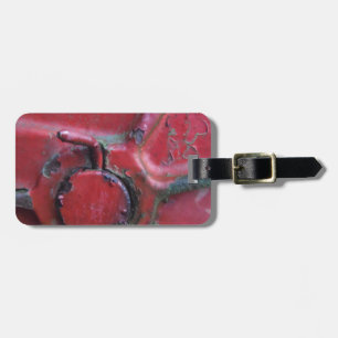 Red rusty truck close-up luggage tag