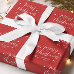 Red Script Typography Family Name Merry Christmas Wrapping Paper<br><div class="desc">Red script typography Merry Christmas wrapping paper with festive Holiday stars. Personalise this gift wrap with the family name,  year,  or any custom text.</div>