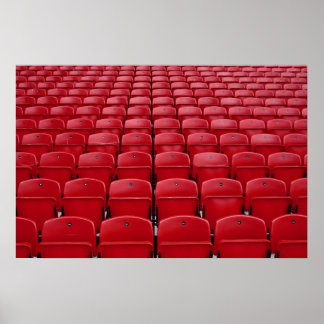 Red seats at football stadium poster
