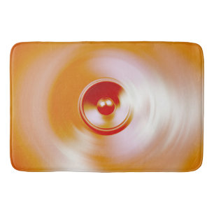 Red spinning music speaker bath mat