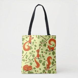 Red squirrel in hazel branches. tote bag