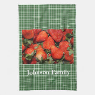 Red strawberry in green plaids kitchen towel. tea towel