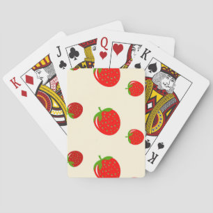 Red strawberry on pink playing cards