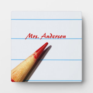 Red Teacher Pencil On Lined Paper With Name Plaque