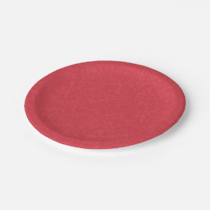 Red textured surface with subtle swirling pattern paper plate