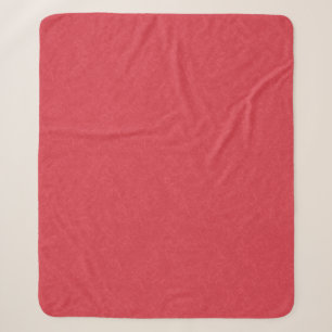 Red textured surface with subtle swirling pattern sherpa blanket