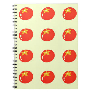 Red tomamtoes on yellow notebook