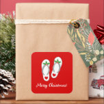 Red tropical Christmas holly leaf beach flip flops Square Sticker<br><div class="desc">Red tropical Christmas holly leaf beach flip flops Square Sticker. Funny beach sandals design for winter Holiday season in warm location. Cute slippers with hearts. Customisable background colour and text template. Stylish script typography template. Great for Christmas in July,  Hawaii,  California,  Florida and other sunny places.</div>