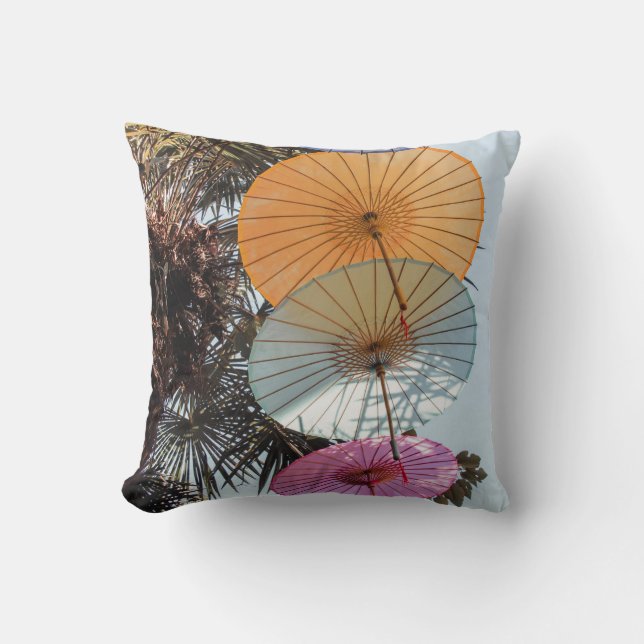 Red umbrella on green tree cushion (Front)