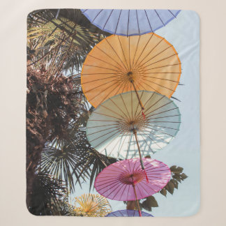 Red umbrella on green tree sherpa blanket