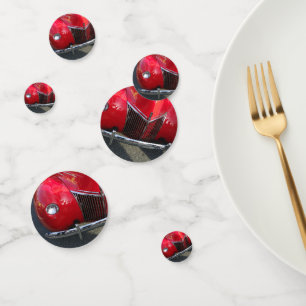 Red Vintage 1930s auto on table confetti