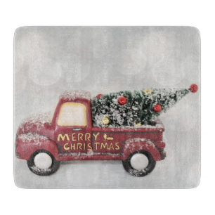red vintage truck on a grey bokeh background cutting board