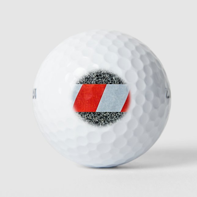 Red warning tape across granite stone golf balls (Front)