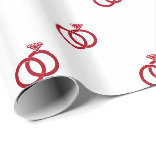 Red Wedding Rings on White Wrapping Paper