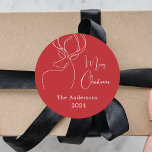 Red white abstract reindeer modern Christmas Classic Round Sticker<br><div class="desc">Red background,  and a white abstract one line reindeer.  Personalise and add a name and year. Text: Merry Christmas</div>