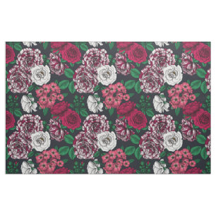 Red, white and bi-color roses with green leaves on fabric