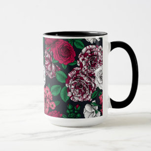 Red, white and bi-color roses with green leaves on mug