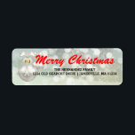 Red White Merry Christmas Return Address Labels<br><div class="desc">Merry Christmas is written in red across a winter white abstract background. A large white ornament with a snowflake design creates the left border. Your family name and address is written in a modern simple font below. Super easy to customise all of the text. Change Merry Christmas to Happy Holidays...</div>