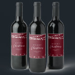 Red & White String Lights Snow Merry Christmas Wine Label<br><div class="desc">Celebrate the season with this stylish custom Christmas wine label. This label design features "Merry Christmas" text and a festive snowflake and string lights background. You can personalise the text. More holiday stationery and party supplies are available at my shop BaraBomDesign.</div>