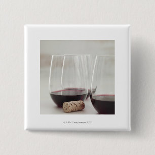 Red wine in stemless glasses 15 cm square badge
