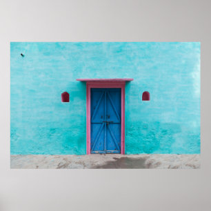 RED WOODEN DOOR ON BLUE CONCRETE WALL POSTER