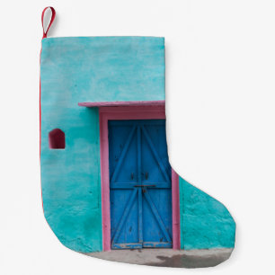RED WOODEN DOOR ON BLUE CONCRETE WALL SMALL CHRISTMAS STOCKING