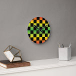 Red Yellow Green Rasta Ombre Chequerboard Round Clock<br><div class="desc">Make a bold statement with the Red Yellow Green Rasta Ombre Chequerboard Round Clock. Featuring a vibrant ombre gradient in classic Rasta colours with a chequered pattern,  this clock adds a cultural and energetic touch to any space. Perfect for bringing style and personality to your home or office.</div>