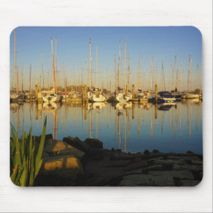 Reflection of boats in a harbor. mouse pad