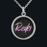*~* Reiki Jewellery With Intention (R) Pink Text<br><div class="desc">*Round necklace with a black background with the word "Reiki" in an iridescent pink text design.* Reiki Masters, Reiki Practitioners and Reiki Students will not be the only ones drawn to this amazing necklace. This little beauty will make a great gift to someone newly attuned to Reiki. If you find...</div>