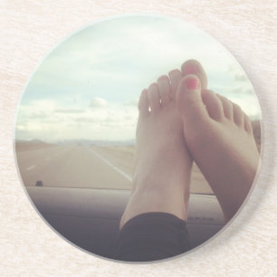 relax feet on the dashboard coaster