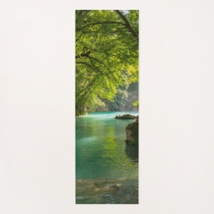 Relaxing landscape with water and trees yoga mat