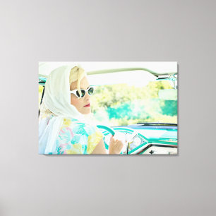 Retro 1950s model driving a vintage turquoise car canvas print