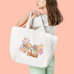 Retro Daisy, Rainbow and Butterflies Quote  Tote Bag<br><div class="desc">This design with the quote "You are magic" and a retro graphic featuring colourful rainbows, wildflowers, and butterflies is the perfect way to express your unique and positive personality! The retro graphic design features a vibrant rainbow, surrounded by a beautiful array of wildflowers and butterflies, reminding you of the beauty...</div>