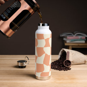 Retro groovy chequered background in orange water bottle