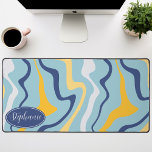 Retro Modern Abstract Marble Swirl Blue And Yellow Desk Mat<br><div class="desc">Immerse yourself in a dance of colours with our Abstract Retro Modern Liquid Marble Wave Pattern. Evoking the dynamic fluidity of marbled surfaces and the charming aesthetics of retro-modern design, this pattern is a feast for the eyes. A symphony of vibrant colours swirls and flows in wave-like motions, creating a...</div>