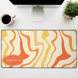 Retro Modern Abstract Marble Swirl Orange Yellow Desk Mat<br><div class="desc">Immerse yourself in a dance of colours with our Abstract Retro Modern Liquid Marble Wave Pattern. Evoking the dynamic fluidity of marbled surfaces and the charming aesthetics of retro-modern design, this pattern is a feast for the eyes. A symphony of vibrant colours swirls and flows in wave-like motions, creating a...</div>