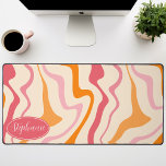 Retro Modern Abstract Marble Swirl Pink Orange Desk Mat<br><div class="desc">Immerse yourself in a dance of colours with our Abstract Retro Modern Liquid Marble Wave Pattern. Evoking the dynamic fluidity of marbled surfaces and the charming aesthetics of retro-modern design, this pattern is a feast for the eyes. A symphony of vibrant colours swirls and flows in wave-like motions, creating a...</div>