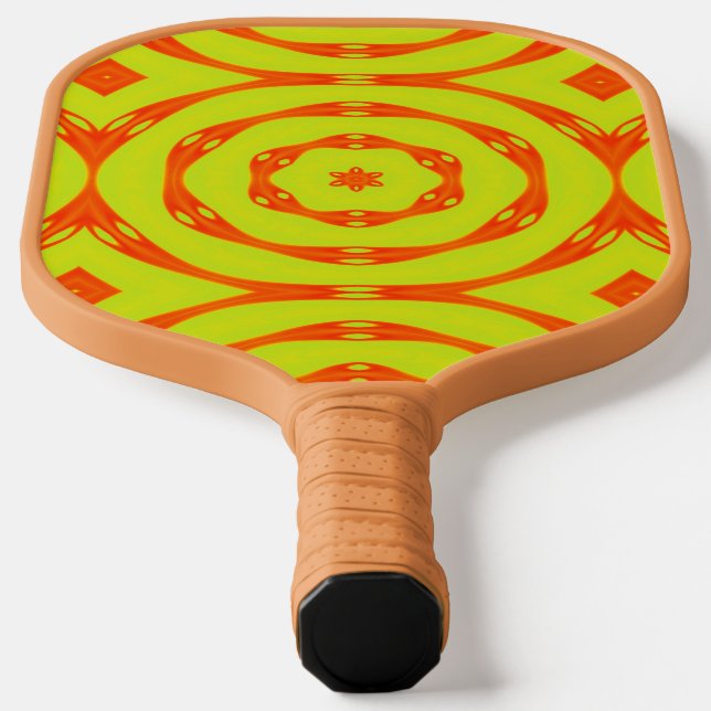 Retro orange circle on yellow pickleball paddle (Laydown)