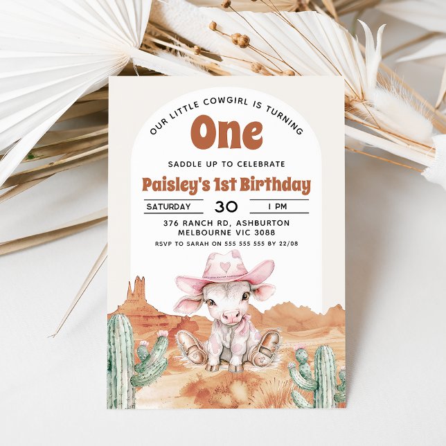 Retro Pink Cow Cowgirl Wild West 1st Birthday Invitation (Cow cowgirl themed 1st birthday invitation with cow, pink cowgirl hat, desert and retro text.)