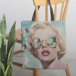 Retro Pop Art Pink and Blue Space Woman Tote Bag<br><div class="desc">This eye-catching design features a glamourous woman in oversized reflective sunglasses, evoking retro pop art charm. With her bold pink lips and vintage waves, the coquette aesthetic shines through, while the mirrored lenses reflect a cosmic, otherworldly scene, blending classic beauty with a futuristic twist. Floating bubbles add a playful, surreal...</div>
