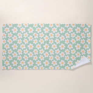 Retro style daisies in bloom on green background beach towel