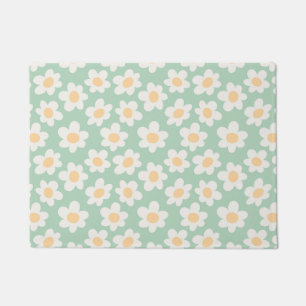 Retro style daisies in bloom on green background doormat