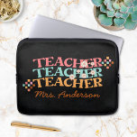 Retro Teacher in Colourful 70s Style Laptop Sleeve<br><div class="desc">Elevate your teacher's style with our personalised Groovy Retro Teacher in Colourful 70s Style Laptop Sleeve! A perfect gift for Teacher Appreciation Day. Featuring vibrant 70s colours and curved "teacher" text on a black chalkboard background, adorned with flower and chequered illustrations. Personalise it with the teacher's name for a truly...</div>