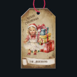 Retro Vintage Baby Girl Gift Boxes Merry Christmas Tags<br><div class="desc">Beautiful retro vintage illustration of a baby girl sitting among a bunch of colourful Christmas gift boxes on a retro grunge background and frame for an aged or vintage look. Design features a vintage scroll ribbon for your personalisation both in the front or the back sides of this elegant, and...</div>