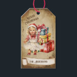 Retro Vintage Baby Girl Gift Boxes Merry Christmas Tags<br><div class="desc">Beautiful retro vintage illustration of a baby girl sitting among a bunch of colourful Christmas gift boxes on a retro grunge background and frame for an aged or vintage look. Design features a vintage scroll ribbon for your personalisation both in the front or the back sides of this elegant, and...</div>