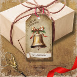 Retro Vintage Gold Brass Bell Merry Christmas Gift Tags<br><div class="desc">Beautiful retro vintage illustration of a gold brass bell decorated with a golden bow on a retro grunge background and frame for an aged or vintage look. Design features a vintage scroll ribbon for your personalisation both in the front or the back sides of this elegant, and timeless Holiday Gift...</div>