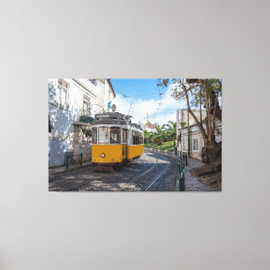 Retro yellow tram on street in Lisbon, Portugal Canvas Print