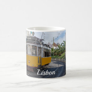 Retro yellow tram on street in Lisbon, Portugal Coffee Mug