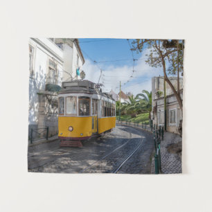 Retro yellow tram on street in Lisbon, Portugal Tapestry