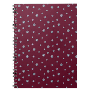 Rhinestones on dark red notebook